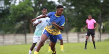 Ludzeludze Killers FC and Lozitha Spurs FC battle for possession during their MulaSport National First Division