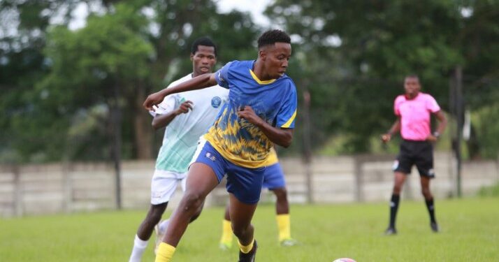 Ludzeludze Killers FC and Lozitha Spurs FC battle for possession during their MulaSport National First Division