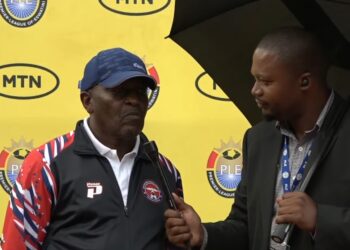 Coach Caleb Ngwenya speaks to an Eswatini TV reporter after Mbabane Swallows’ derby win over Highlanders.