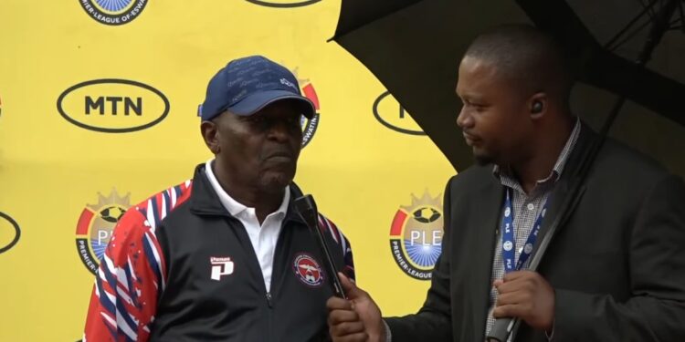 Coach Caleb Ngwenya speaks to an Eswatini TV reporter after Mbabane Swallows’ derby win over Highlanders.