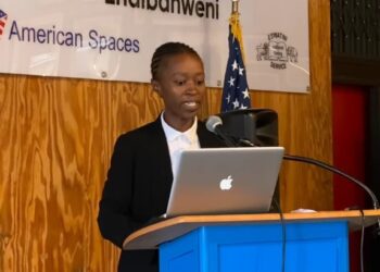 Sakhile Nsibandze, president of the Youth Chamber of Commerce & Industries Eswatini, addresses the audience on expanding support for young entrepreneurs across the country.