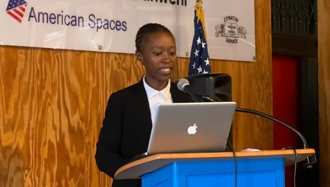 Sakhile Nsibandze, president of the Youth Chamber of Commerce & Industries Eswatini, addresses the audience on expanding support for young entrepreneurs across the country.