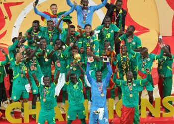 Senegal's Sadio Mane holds the trophy aloft as he celebrates with teammates after winning the Africa Cup of Nations final soccer match between Senegal and Morocco in Rabat, Morocco, Sunday, Jan. 18, 2026. (AP Photo/Youssef Loulidi)