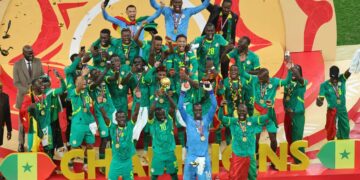 Senegal's Sadio Mane holds the trophy aloft as he celebrates with teammates after winning the Africa Cup of Nations final soccer match between Senegal and Morocco in Rabat, Morocco, Sunday, Jan. 18, 2026. (AP Photo/Youssef Loulidi)