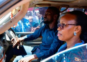 Ugandan opposition leader, Robert Kyagulanyi, aka Bobi Wine travelling with his wife, Barbara Kyagulanyi, in this previous photo is reportedly wanted dead or alive in Uganda. Photo by Reuters.