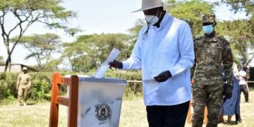 Ugandan President Yoweri Museveni casts his ballot at a polling station during the country’s presidential election