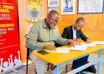 Melusi Zox Dlamini of A Peculiar People and Sakhile Sibandze, president of the Youth Chamber of Commerce and Industry Eswatini, during the signing of the memorandum of understanding to support youth entrepreneurship under the Made in Eswatini initiative in Mbabane. Photo by Khulekile Mhlanga