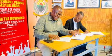 Melusi Zox Dlamini of A Peculiar People and Sakhile Sibandze, president of the Youth Chamber of Commerce and Industry Eswatini, during the signing of the memorandum of understanding to support youth entrepreneurship under the Made in Eswatini initiative in Mbabane. Photo by Khulekile Mhlanga