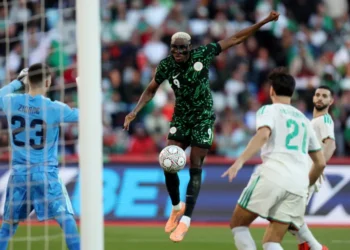 Victor Osimhen scores Nigeria's first goal [Amr Abdallah Dalsh/Reuters]