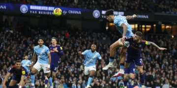 Nico O'Reilly rises above the Newcastle defence to head home his second goal of the night, sealing a crucial victory for Manchester City at the Etihad Stadium.