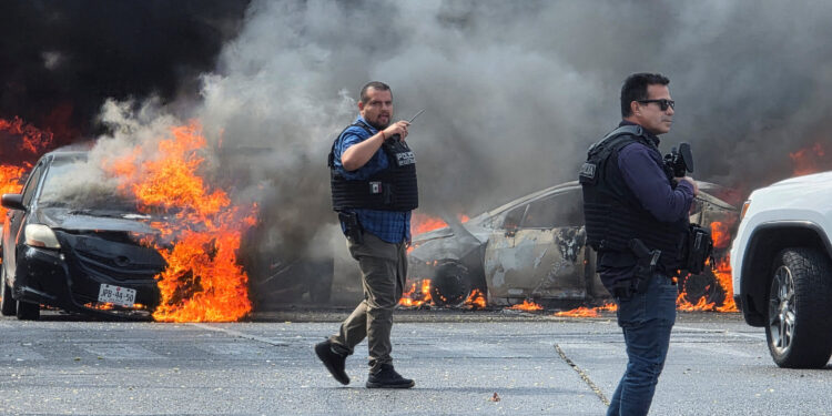 After the Mexican government said it had killed one of the country’s most violent criminal figures, Nemesio Oseguera Cervantes, known as El Mencho, armed groups set fires to buildings and vehicles across Mexico.CreditCredit...Gilberto Gallo/Reuters