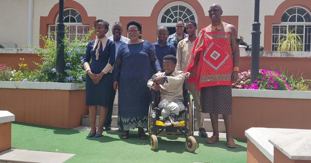 Sifiso Maseko poses with the Acting Prime Minister, Thulisile Dladla, alongside officials from the Deputy Prime Minister’s Office and BSA Training Centre after presenting his redesigned wheelchair.