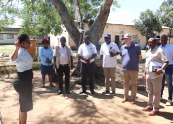British High Commissioner to Eswatini His Excellency Colin Wells, accompanied by officials from the Ministry of Home Affairs and World Vision Eswatini, is taken on a guided tour of facilities at the Malindza Refugee Reception Centre during an official visit. Photo: World Vision Eswatini.