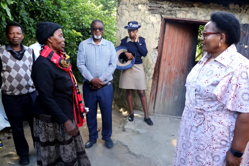 Acting Prime Minister Thulisile Dladla hands over a new house to Gogo Lucy Ntombane Motsa in Mpolonjeni, Motshane Inkhundla.