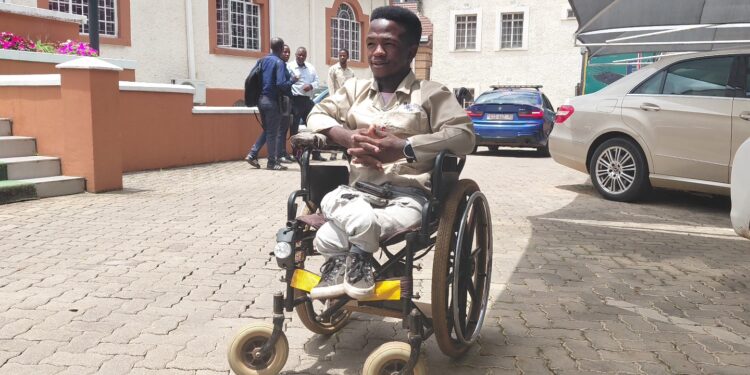 Sifiso Maseko, an Auto Electrical student at BSA Training Centre, showcases his modified wheelchair fitted with lights, a horn and reflectors as part of his innovation project. Photo by DPMO
