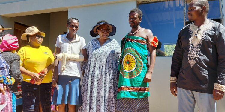 Deputy Prime Minister Thulisile Dladla hands over house keys to one of the beneficiaries during the official handover of newly constructed homes in one of the constituencies this week. Photo: Deputy Prime Minister’s Office