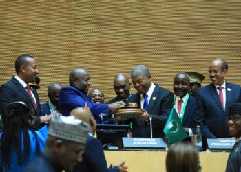 Outgoing African Union Chairperson President João Manuel Gonçalves Lourenço of Angola hands over to President Évariste Ndayishimiye of Burundi during the ceremony in Addis Ababa on 14 February 2026.