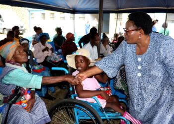 Senator Thulisile Dladla interacts with residents during the Thanksgiving Celebration Ceremony at the Mankayane Old Age Home and Facility for Persons with Disabilities.