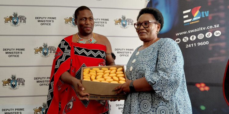 Eswatini TV CEO Mlamuli Dlamini presents sunscreens to Deputy Prime Minister Thulisile Dladla at the DPM’s Office in Mbabane. Photo by DPMO