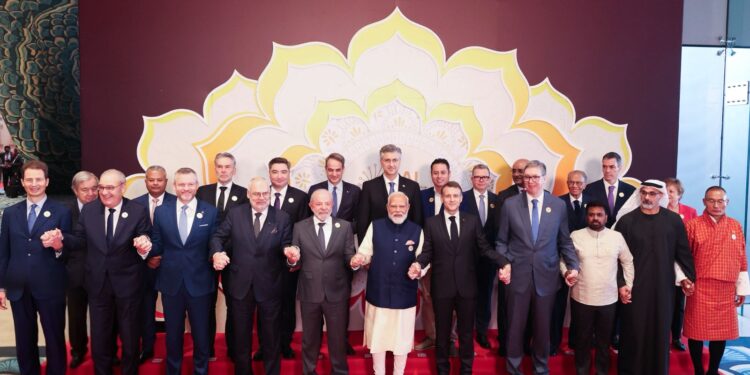 India’s Prime Minister Narendra Modi with world leaders and global technology executives during the India AI Impact Summit in New Delhi.