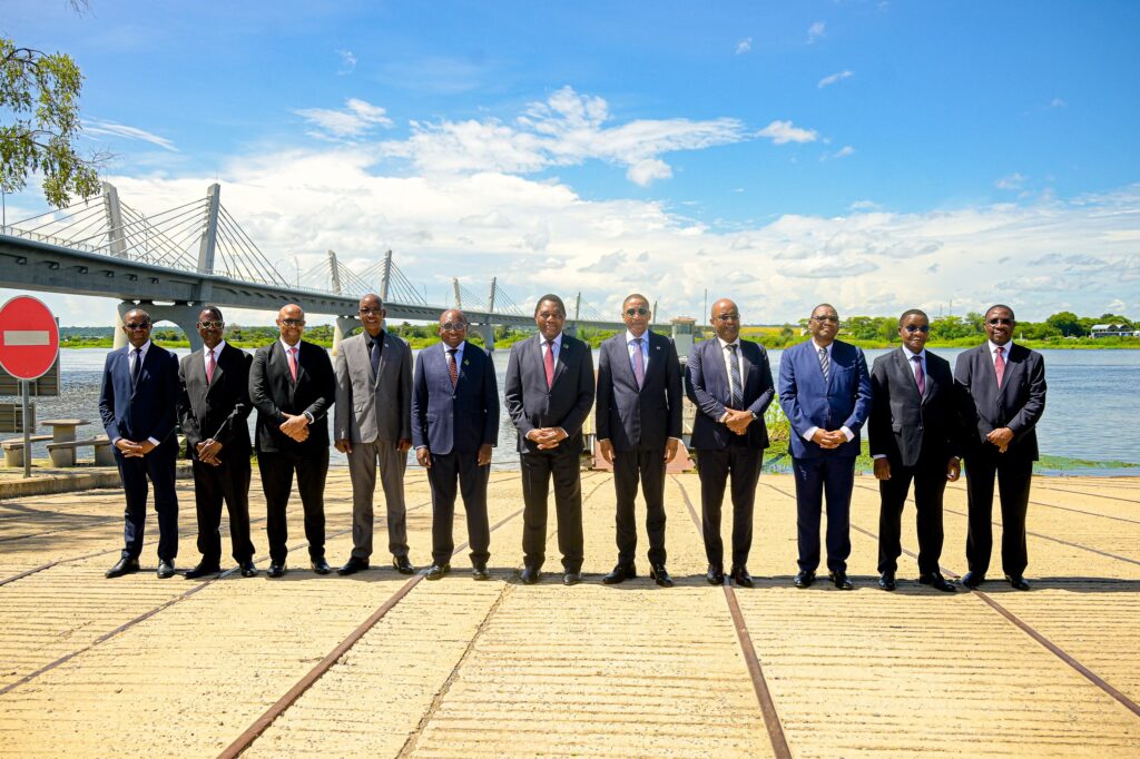 President Duma Boko of Botswana and President Hakainde Hichilema of Zambia pose with their respective government delegations following the official launch ceremony in Kazungula.