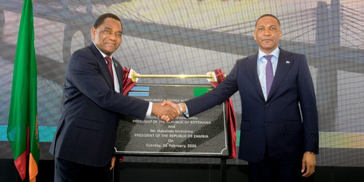 Duma Boko and Hakainde Hichilema shake hands beside the commemorative plaque during the launch of the Kazungula Bridge Authority at Kazungula on Tuesday.
