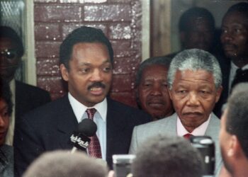 American civil rights leader Jesse Jackson and freed South African black nationalist leader Nelson Mandela answer reporters' questions after Jackson's visit to Mandela's Soweto house February 15, 1990. REUTERS/File Photo
