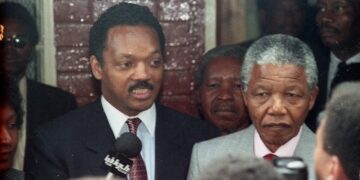 American civil rights leader Jesse Jackson and freed South African black nationalist leader Nelson Mandela answer reporters' questions after Jackson's visit to Mandela's Soweto house February 15, 1990. REUTERS/File Photo