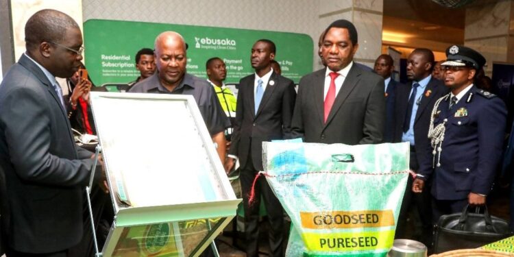 Zambian President Hakainde Hichilema and Ghanaian President John Dramani Mahama examine local farm produce during the Ghana–Zambia business dialogue in Lusaka.