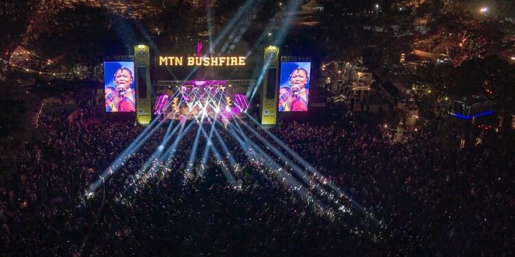 Festival goers fill the grounds of House On Fire during MTN Bushfire 2025 as South African music icon Thandiswa Mazwai delivers a powerful performance on the main stage.