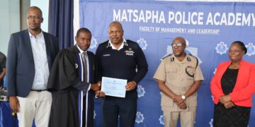 National Commissioner of Police, Mr Manoma Vusie Masango, presents a Diploma in Police Science certificate to one of the 27 graduating officers at the Matsapha Police Academy on February 17, 2026.