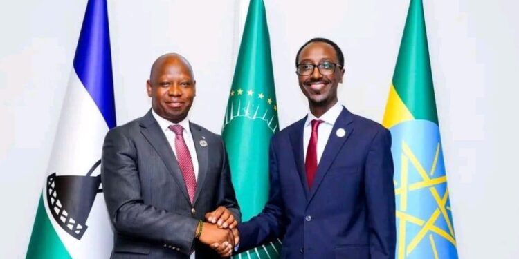 Lesotho’s Minister of Foreign Affairs and International Relations Lejone Mpotjoane and Ethiopia’s Foreign Affairs Minister Gideon Timothewos exchange a handshake during a bilateral meeting on the sidelines of the African Union Summit in February 2026.