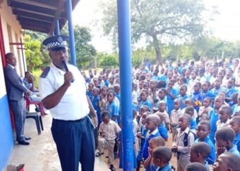 A police officer speaks to school learners at Njonjane Primary School on bullying and safety awareness. Photo by REPS