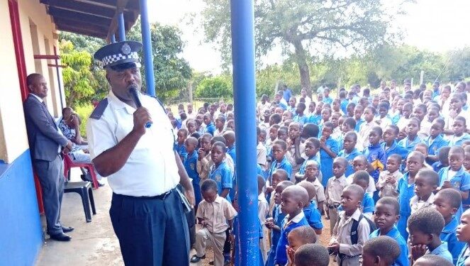 A police officer speaks to school learners at Njonjane Primary School on bullying and safety awareness. Photo by REPS