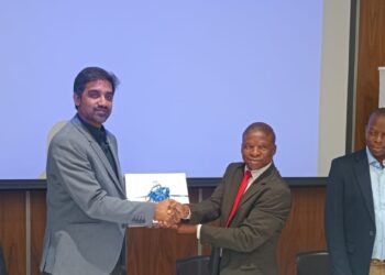 EWADE CEO Dr Samson Sithole shakes hands with a representative of GVPR Engineers Limited after signing the MNWAP Phase 1B Main Conveyance Pipeline contract on Monday.