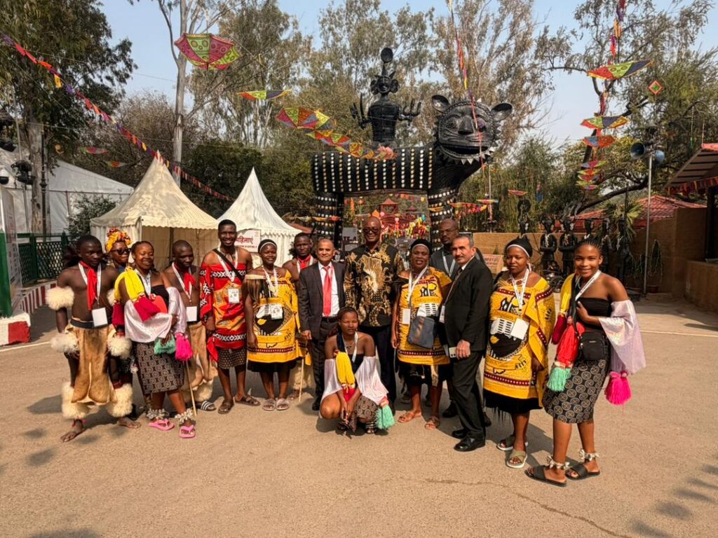Eswatini Cultural Troupe and gospel artist Siphiwo Ndoni receive a morale boost from H.E. Menzi Dlamini during his visit to the 39th Surajkund International Crafts Mela in India.