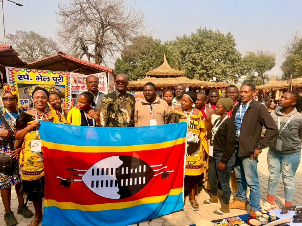 Eswatini Cultural Troupe and gospel artist Siphiwo Ndoni receive a morale boost from H.E. Menzi Dlamini during his visit to the 39th Surajkund International Crafts Mela in India.