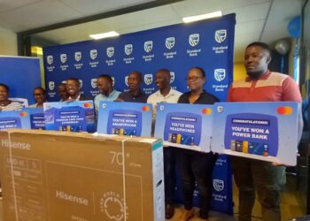 Some of the winners proudly display their prizes after receiving them during the Standard Bank Eswatini Choose Standard Bank campaign prize presentation ceremony in Mbabane.