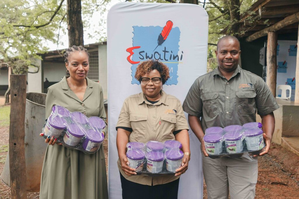 The Minister of Tourism and Environmental Affairs Hon. Jane Mkhonta-Simelane and ETA CEO Vusie Norman Dlamini carry a box of Parmalat yoghurts in appreciation of sponsor support during the Easter campaign unveiling.