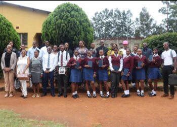 Officials from the Ministry of Information, Communications and Technology’s RSTI department pose for a group photo with learners and teachers at Mpaka High School after concluding the first cohort of the National STEM Mentorship and Science in Uniform Back to School Campaign.