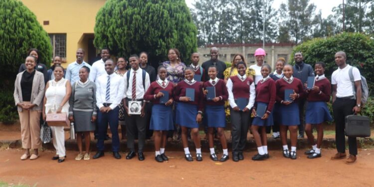 Officials from the Ministry of Information, Communications and Technology’s RSTI department pose for a group photo with learners and teachers at Mpaka High School after concluding the first cohort of the National STEM Mentorship and Science in Uniform Back to School Campaign.