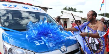 His Majesty King Mswati III cuts the ribbon during the commissioning of one of the new Emergency Medical Services ambulances at Mshinande in Mshingishingini.