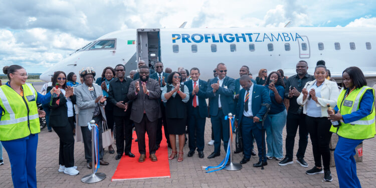 Proflight Zambia officials, aviation stakeholders and invited guests pose for a group photo during the launch of the Lusaka Livingstone Windhoek