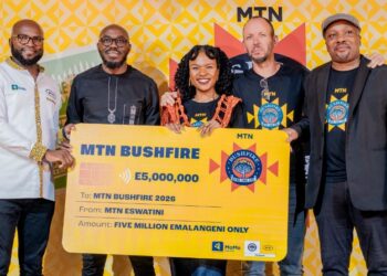 MTN Eswatini officials, MTN Bushfire organisers and partners pose for a group photo with the E5 million cheque during the official launch of MTN Bushfire 2026 at House on Fire in Malkerns.