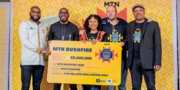 MTN Eswatini officials, MTN Bushfire organisers and partners pose for a group photo with the E5 million cheque during the official launch of MTN Bushfire 2026 at House on Fire in Malkerns.