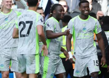 Marc Guehi celebrates with his Manchester City teammates after scoring in their 3 0 Premier League win over Chelsea at Stamford Bridge.