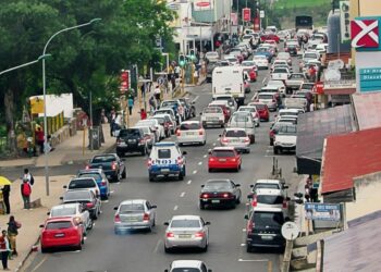 Vehicles navigate through Manzini city centre