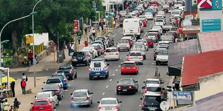 Vehicles navigate through Manzini city centre