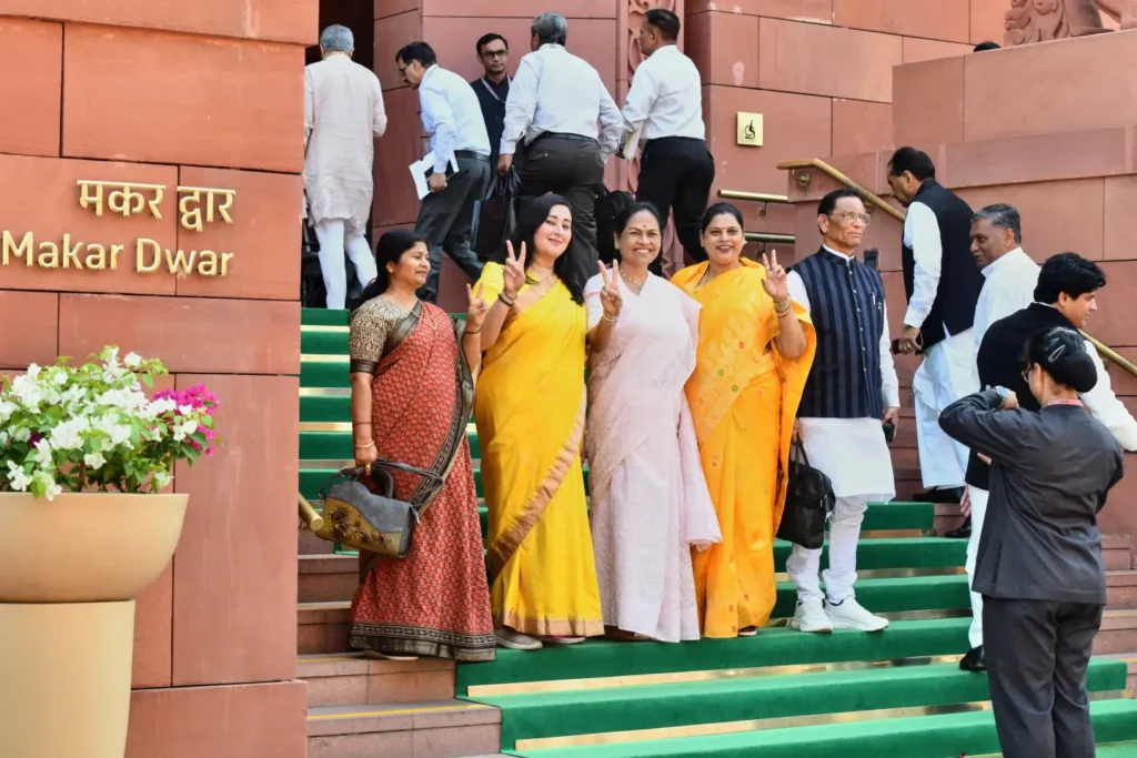 Indian women lawmakers pose outside Parliament House before the start of the debate on a landmark bill to reserve one-third of seats for women, in New Delhi, India, Thursday, April 16, 2026. (AP Photo)