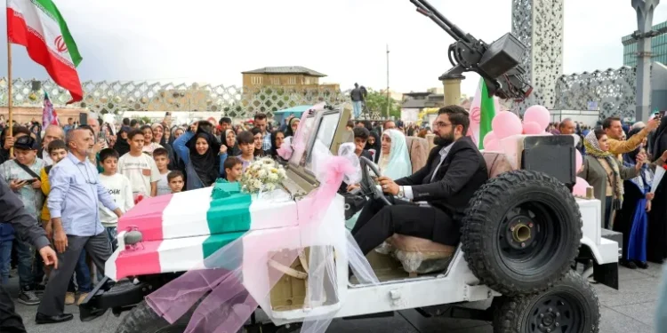 Iran stages mass weddings for couples ready for war ‘sacrifice’